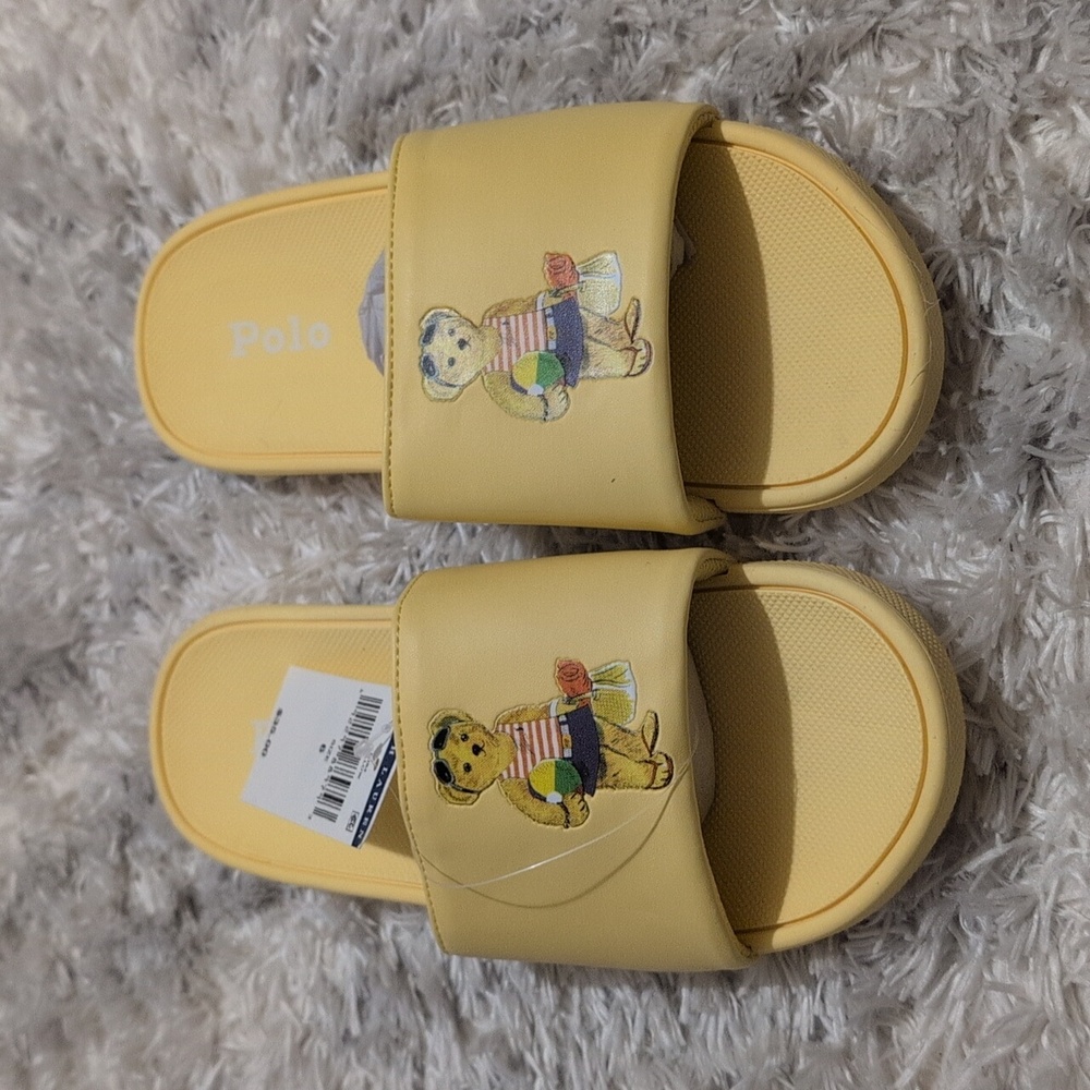 Junior size 6 yellow slippers.